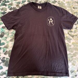 Trampled by Turtles Band T. Taupe with Cowboy Graphic. M. Unisex